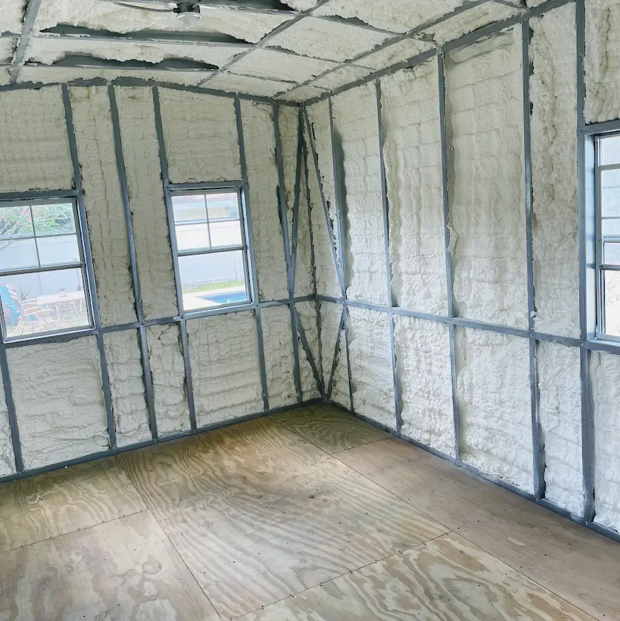 Closed-cell spray foam insulation applied to wall cavities in a residential project in Tuttle